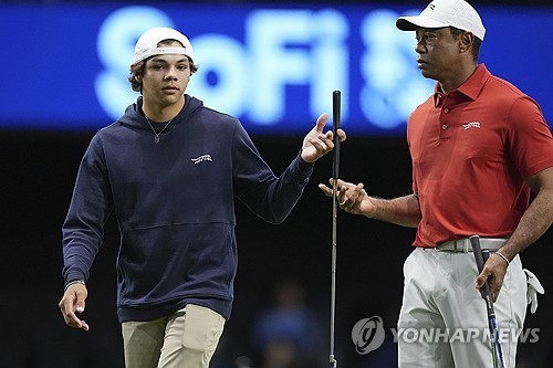 타이거와 찰리 우즈 부자.
