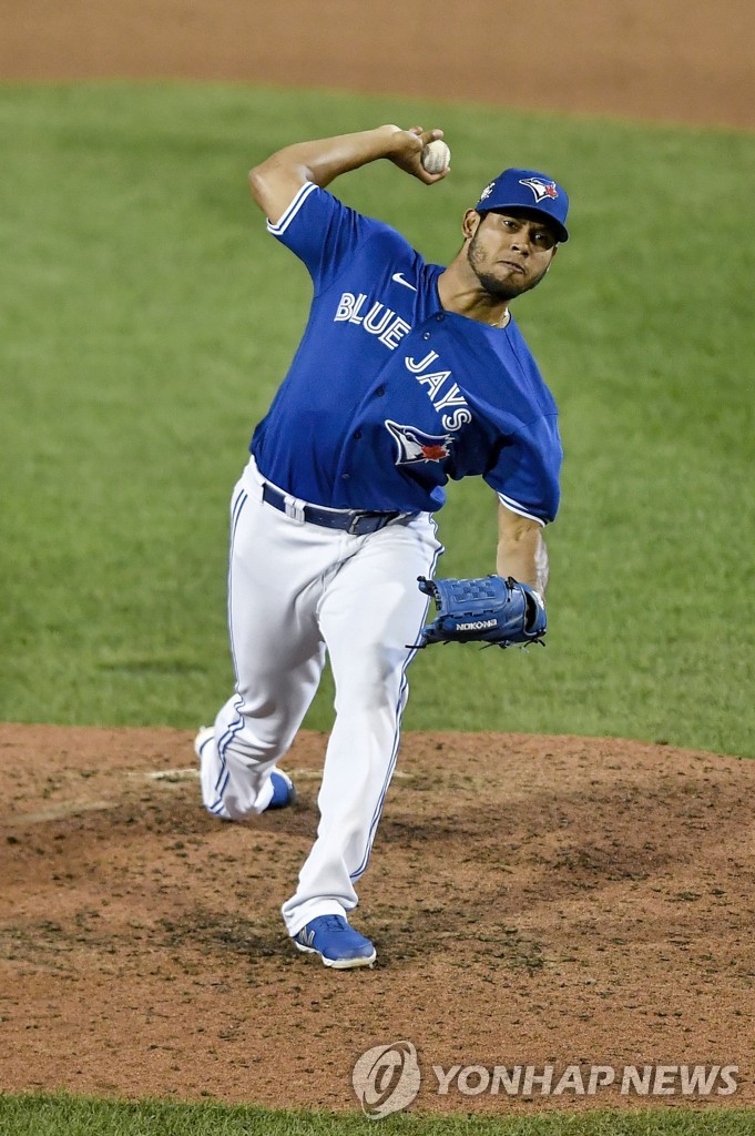 In this Associated Press file photo from Aug. 29, 2020, Wilmer Font of the Toronto Blue Jays pitches against the Baltimore Orioles during the top of the ninth inning of a Major League Baseball regular season game at Sahlen Field in Buffalo, New York. (Yonhap)