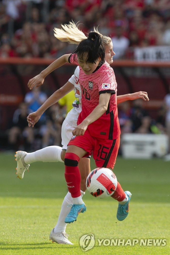 In this Canadian Press photo via Associated Press, Jang Selgi of South Korea (front) and Cloe Lacasse of Canada battle for the ball during the teams' football friendly match at BMO Field in Toronto on June 26, 2022. (Yonhap)