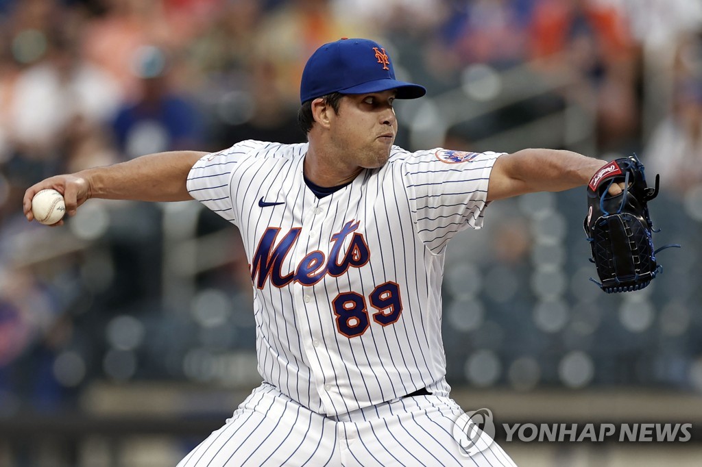 In this Getty Images file photo from July 7, 2021, Robert Stock of the New York Mets pitches against the Milwaukee Brewers in the top of the second inning of a Major League Baseball regular season game at Citi Field in New York. (Yonhap)