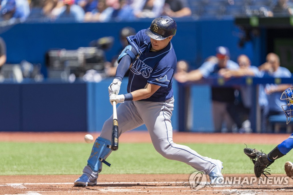 In this USA Today Sports photo via Reuters, Choi Ji-man of the Tampa Bay Rays hits a single against the Toronto Blue Jays during the top of the first inning of a Major League Baseball regular season game at Rogers Centre in Toronto on July 3, 2022. (Yonhap)