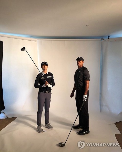 Park Sung-hyun with Tiger Woods