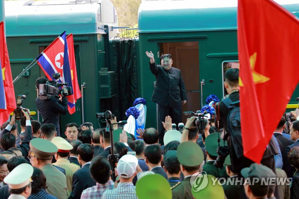 North Korean leader Kim Jong-un waves to a group of officials and citizens before boarding a train at the station in the Vietnamese border town of Dong Dang to head back to his country on March 2, 2019. (Yonhap)