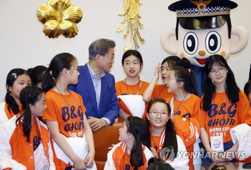 President Moon talks with children