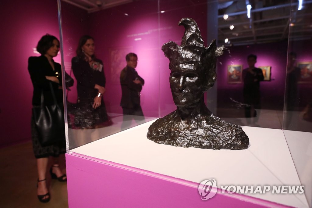 Visitors look at artworks on display during an exhibition titled "Revolution - The new era begins," which opened at Sejong Museum of Art in central Seoul on June 12, 2019. (Yonhap)