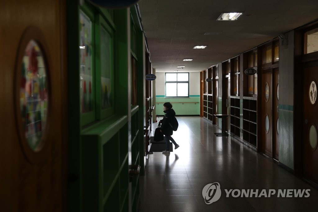 A file photo of a student using a child care program. (Yonhap)