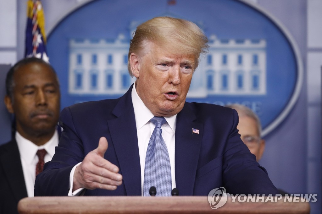 U.S. President Donald Trump addresses a press conference at the White House in Washington on March 21, 2020, in this photo released by the Associated Press. (Yonhap)