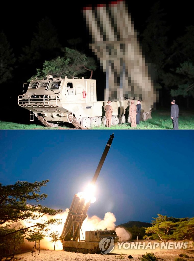 In the photo below, released by North Korea's official Korean Central News Agency on March 30, 2020, the North test-fires super-large multiple rocket launchers the previous day. The photo above shows what the North unveiled as its new large-caliber multiple launch guided rocket system in August last year. (For Use Only in the Republic of Korea. No Redistribution) (Yonhap)