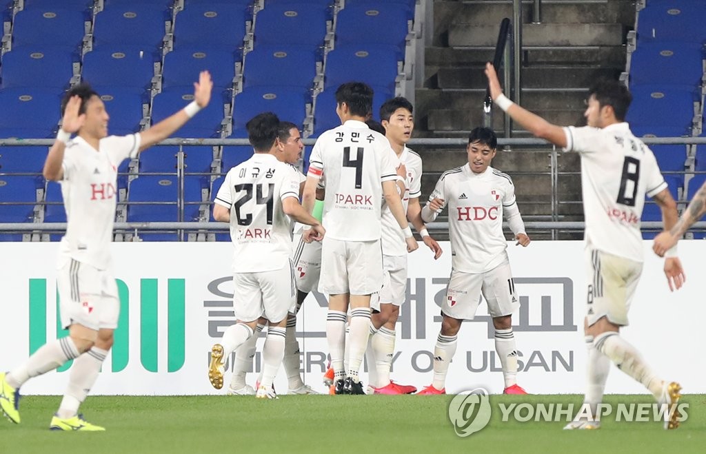 In this file photo, from May 24, 2020, Busan IPark players celebrate their goal against Ulsan Hyundai FC in their K League 1 match at Ulsan Munsu Football Stadium in Ulsan, 400 kilometers southeast of Seoul. (Yonhap)