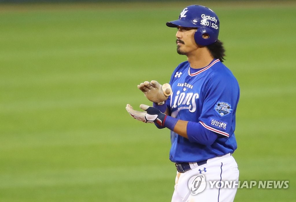In this file photo from June 2, 2020, Tyler Saladino of the Samsung Lions celebrates his double against the LG Twins in a Korea Baseball Organization regular season game at Jamsil Baseball Stadium in Seoul. (Yonhap)