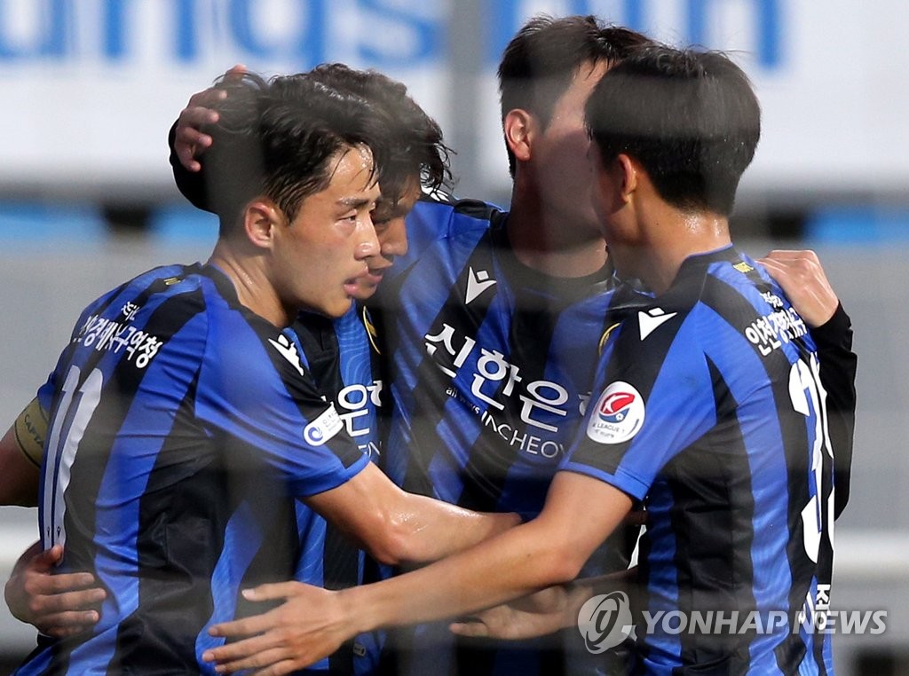 In this file photo from June 5, 2020, Kim Ho-nam of Incheon United (L) celebrates his goal against Gangwon FC with his teammates during their K League 1 match at Incheon Football Stadium in Incheon, 40 kilometers west of Seoul. (Yonhap)