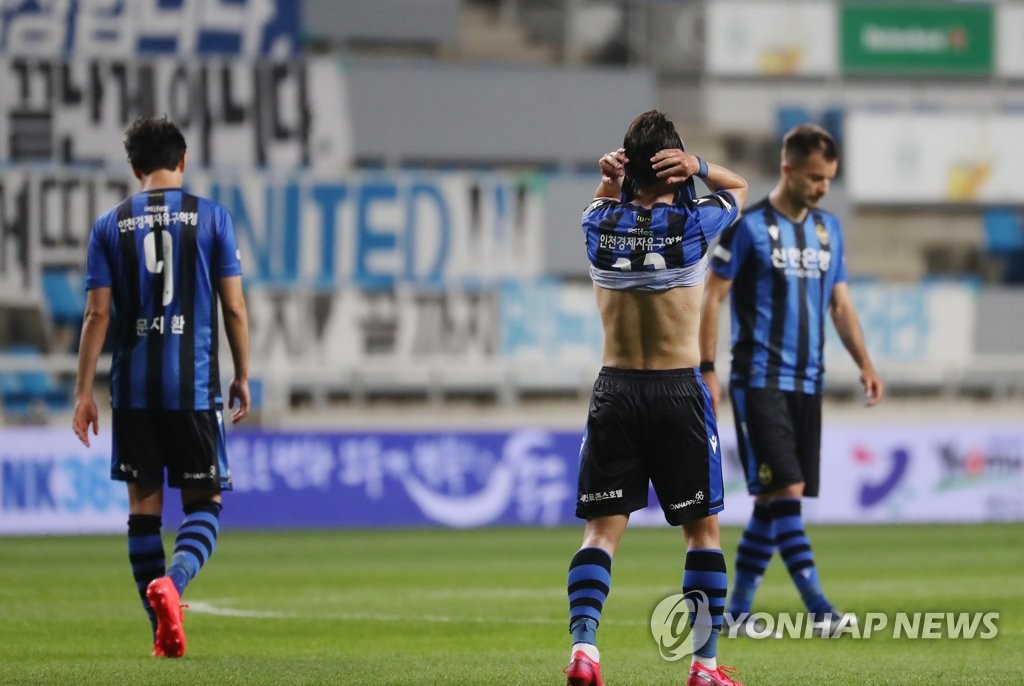 In this file photo from June 5, 2020, members of Incheon United react to their 2-1 loss to Gangwon FC in their K League 1 match at Incheon Football Stadium in Incheon, 40 kilometers west of Seoul. (Yonhap)