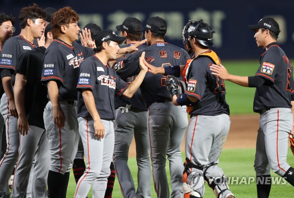 In this file photo, from June 20, 2020, members of the Hanwha Eagles celebrate their 4-3 victory over the NC Dinos in a Korea Baseball Organization regular season game at Changwon NC Park in Changon, 400 kilometers southeast of Seoul. (Yonhap)
