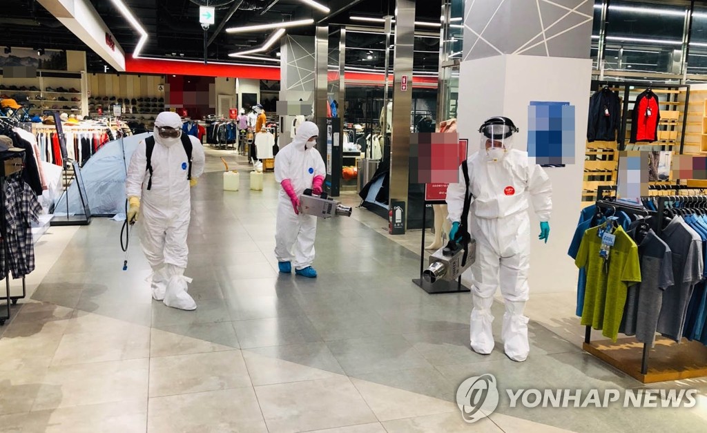 Health workers disinfect a shopping mall in Gwangyang, South Jeolla Province, in this photo provided by the Gwangyang city government on Aug. 27, 2020. (PHOTO NOT FOR SALE) (Yonhap)