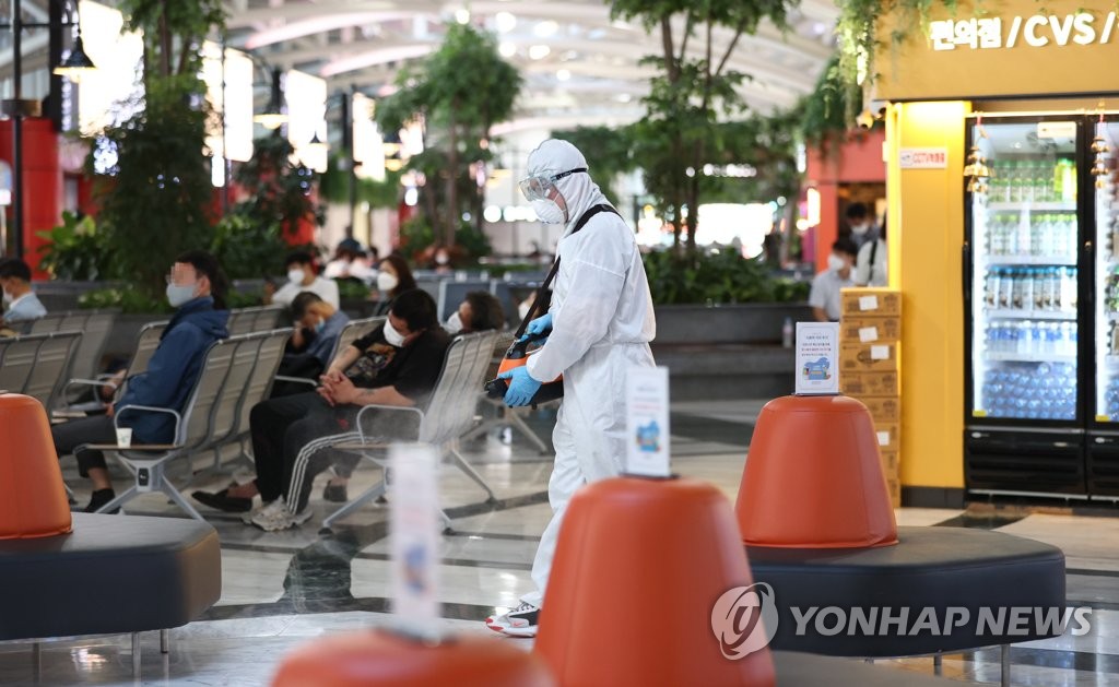 A worker disinfects a bus terminal in southern Seoul on Sept. 4, 2020. (Yonhap)