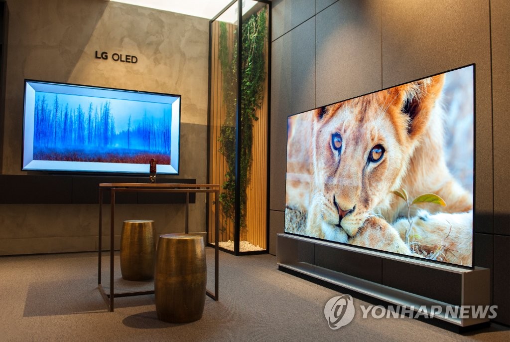 This photo provided by LG Electronics Inc. on June 25, 2021, shows the company's OLED TVs displayed at a shop in Paris. (PHOTO NOT FOR SALE) (Yonhap)