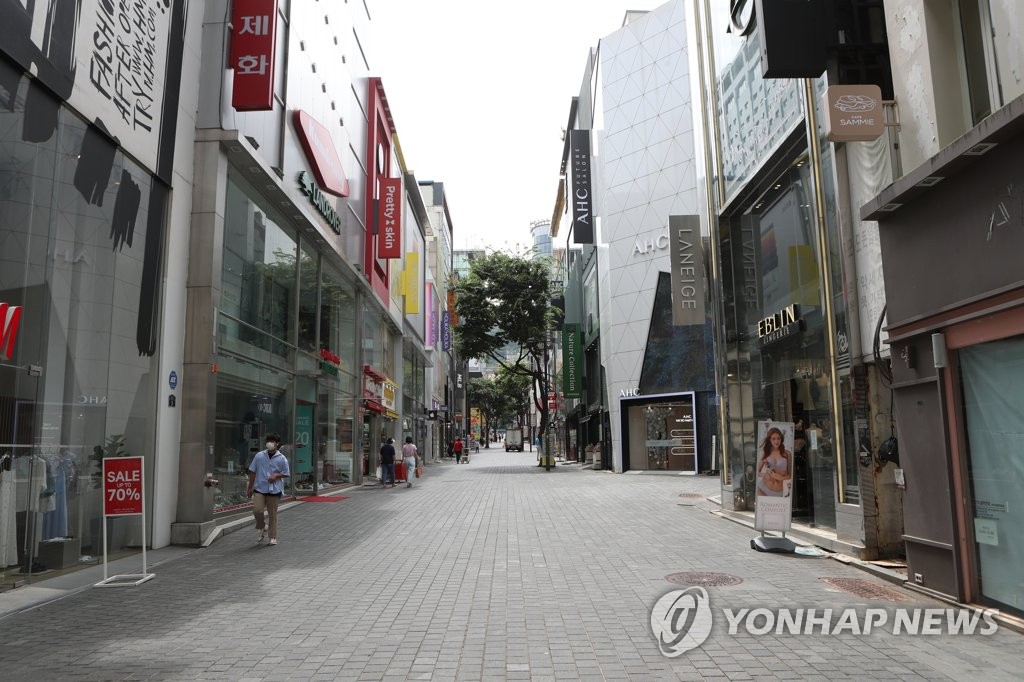 The Myeongdong shopping street in central Seoul is empty on July 14, 2021, amid the toughest social distancing scheme imposed in the capital due to spiking new COVID-19 cases.