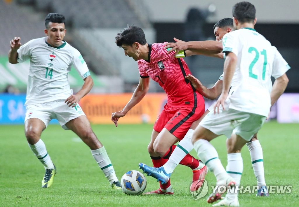 In this file photo, Son Heung-min of South Korea (C) tries to dribble past Iraq defenders during the teams' Group A match in the final Asian qualifying round for the 2022 FIFA World Cup at Seoul World Cup Stadium in Seoul on Sept. 2, 2021. (Yonhap)