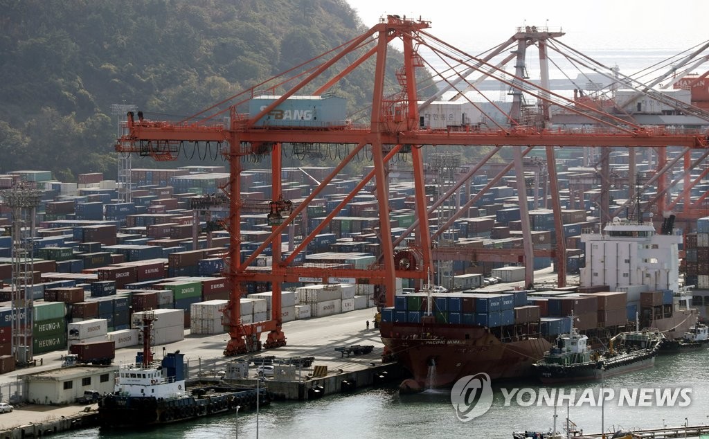 This photo, taken Dec. 7, 2021, shows stacks of containers at a port in South Korea's southeastern city of Busan. (Yonhap)