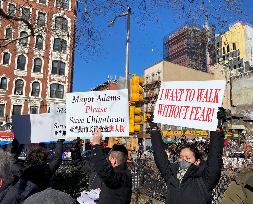 Protesters hold pickets to urge New York City to take actions against rising anti-Asian crime during a rally in Manhattan on Feb. 15, 2022. (Yonhap)