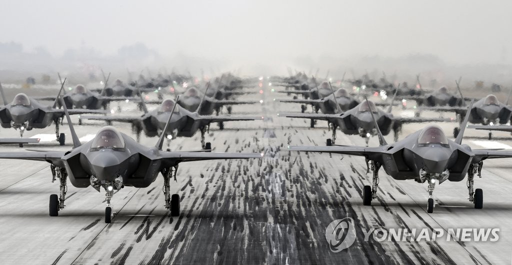 This photo, provided by the defense ministry on March 25, 2022, shows South Korea's F-35A radar-evading fighters engaging in the "Elephant Walk" training at an airfield. (PHOTO NOT FOR SALE) (Yonhap)