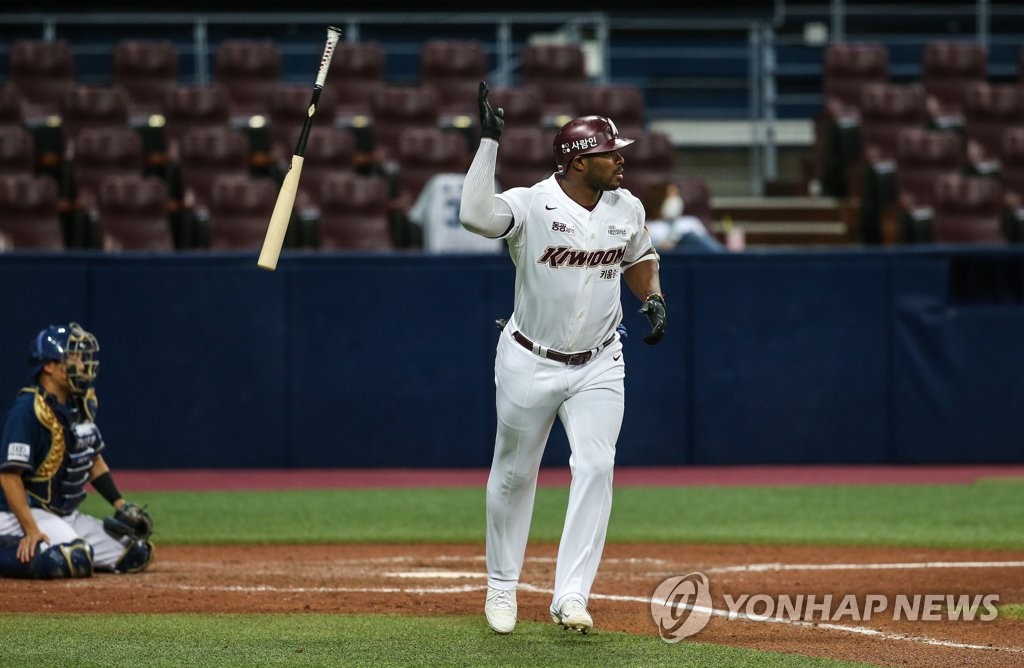 Yasiel Puig of the Kiwoom Heroes flips his bat after hitting a grand slam against the NC Dinos during the bottom of the sixth inning of a Korea Baseball Organization regular season game at Gocheok Sky Dome in Seoul on April 12, 2022, in this photo provided by the Heroes. (PHOTO NOT FOR SALE) (Yonhap)