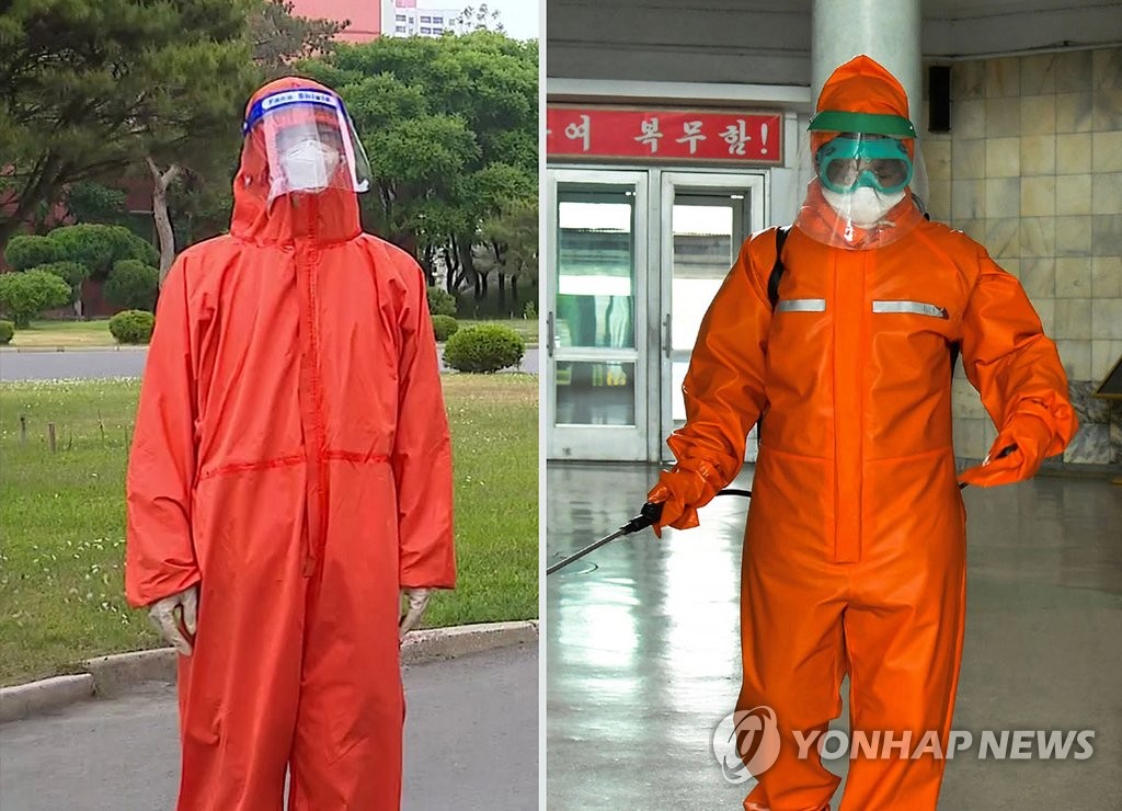 새로운 안면보호구 착용한 북한 방역요원