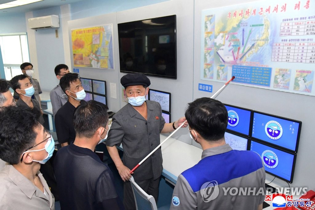 North Korean Premier Kim Tok-hun (2nd from R) inspects the State Hydro-Meteorological Administration, in this undated photo released by the North's Korean Central News Agency on June 29, 2022. (For Use Only in the Republic of Korea. No Redistribution) (Yonhap)
