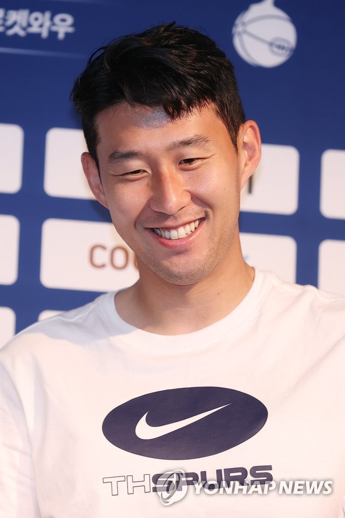 Tottenham Hotspur forward Son Heung-min smiles during a press conference at Seoul World Cup Stadium in Seoul on July 12, 2022, the eve of Tottenham's exhibition match against Team K League. (Yonhap)
