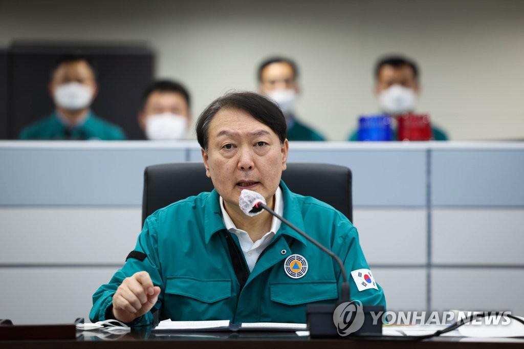 President Yoon Suk-yeol presides over a meeting on the government's readiness against Typhoon Hinnamnor at the crisis management center of the presidential office in Seoul on Sept. 4, 2022, in this photo provided by his office. (PHOTO NOT FOR SALE) (Yonhap)
