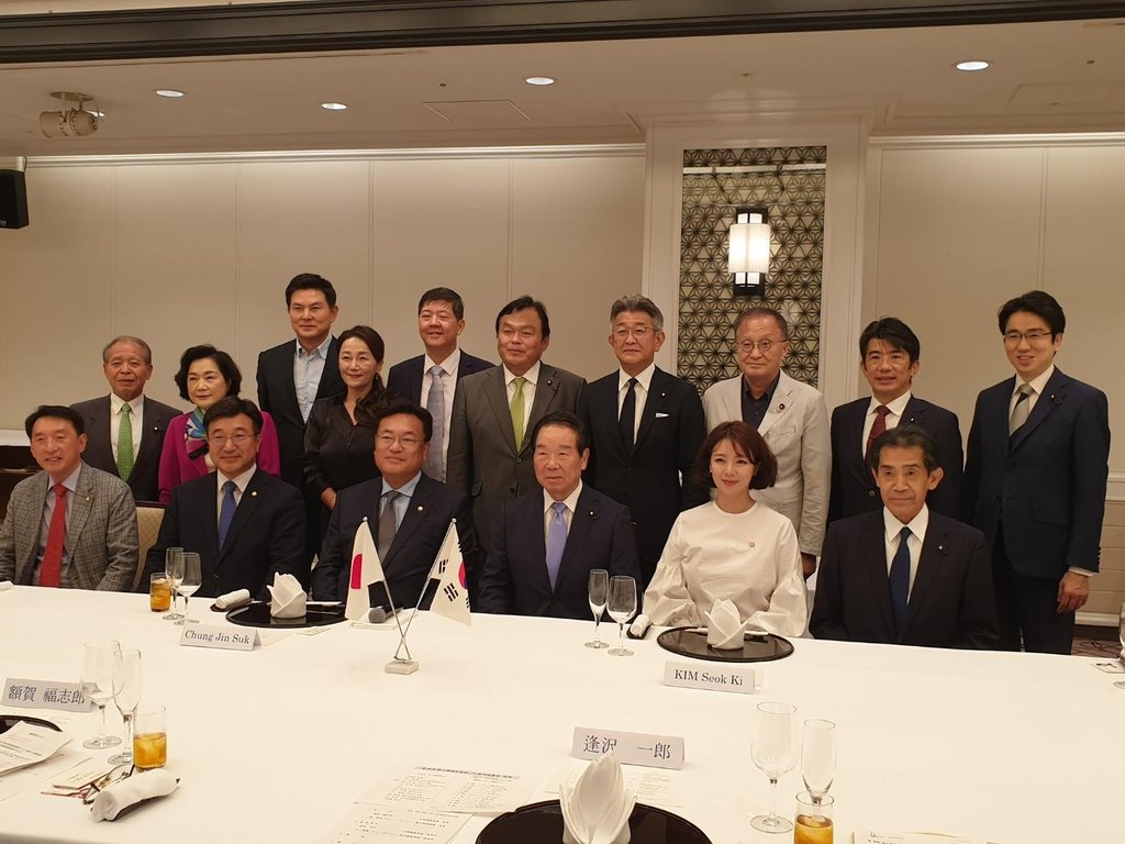 This file photo, provided by the Korea-Japan Parliamentarians' Union, shows members posing for a group photo during their meeting at a Tokyo hotel on Sept. 26, 2022. (PHOTO NOT FOR SALE)