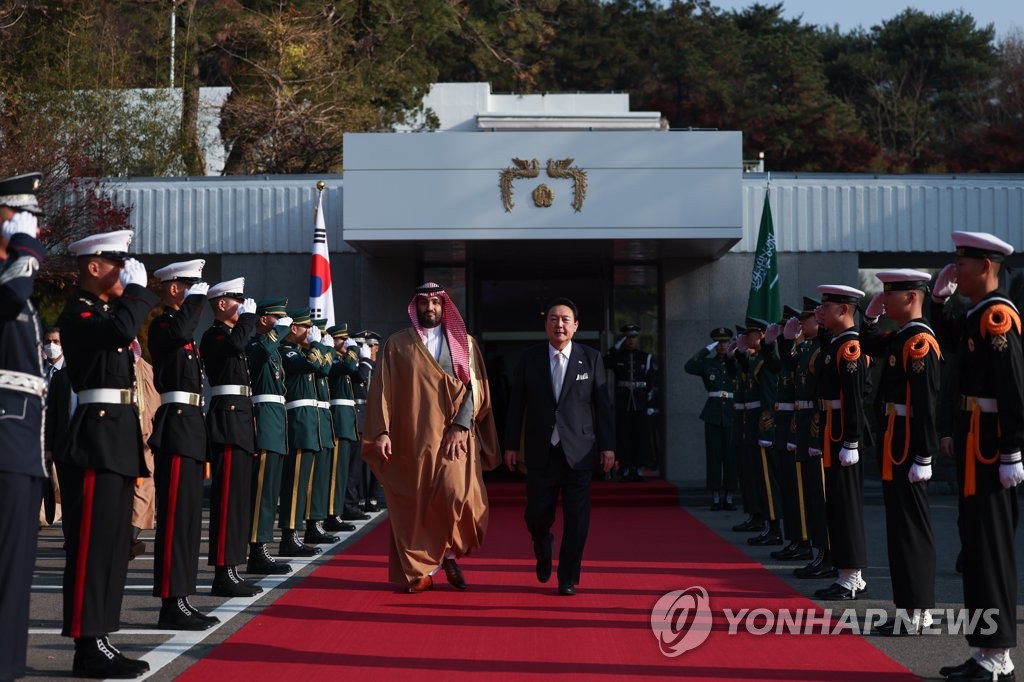 Saudi Crown Prince and Prime Minister Mohammed bin Salman (L) leaves the presidential residence in Seoul on Nov. 17, 2022, after holding talks and a luncheon meeting with South Korean President Yoon Suk-yeol, in this photo provided by the presidential office. (PHOTO NOT FOR SALE) (Yonhap)