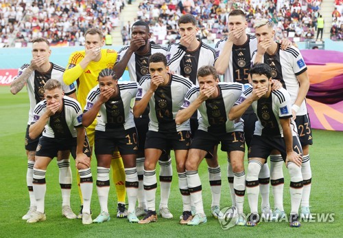 The starting players for Germany pose for their team photo ahead of their Group E match against Japan at the FIFA World Cup at Khalifa International Stadium in Al Rayyan, west of Doha, on Nov. 23, 2022. (Yonhap)