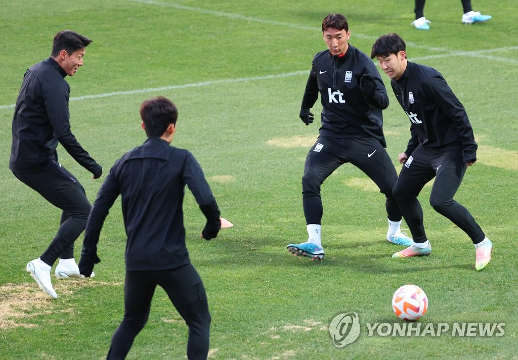 Clockwise from left: South Korean players Hwang Ui-jo, Jung Woo-young, Son Heung-min and Kim Moon-hwan participate in a training session at the National Football Center in Paju, some 30 kilometers northwest of Seoul, on March 26, 2023, in preparation for a friendly match against Uruguay. (Yonhap)