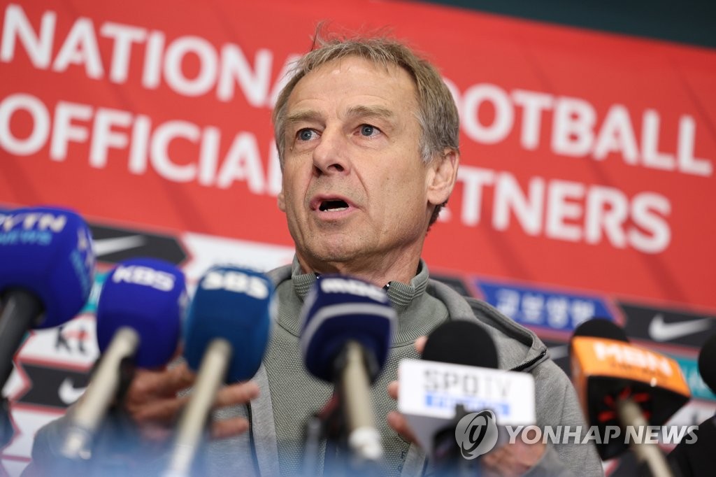 In this file photo from April 26, 2023, Jurgen Klinsmann, head coach of the South Korean men's national football team, speaks with reporters at Incheon International Airport, west of Seoul, after returning from a trip to Europe to meet with national team players. (Yonhap)