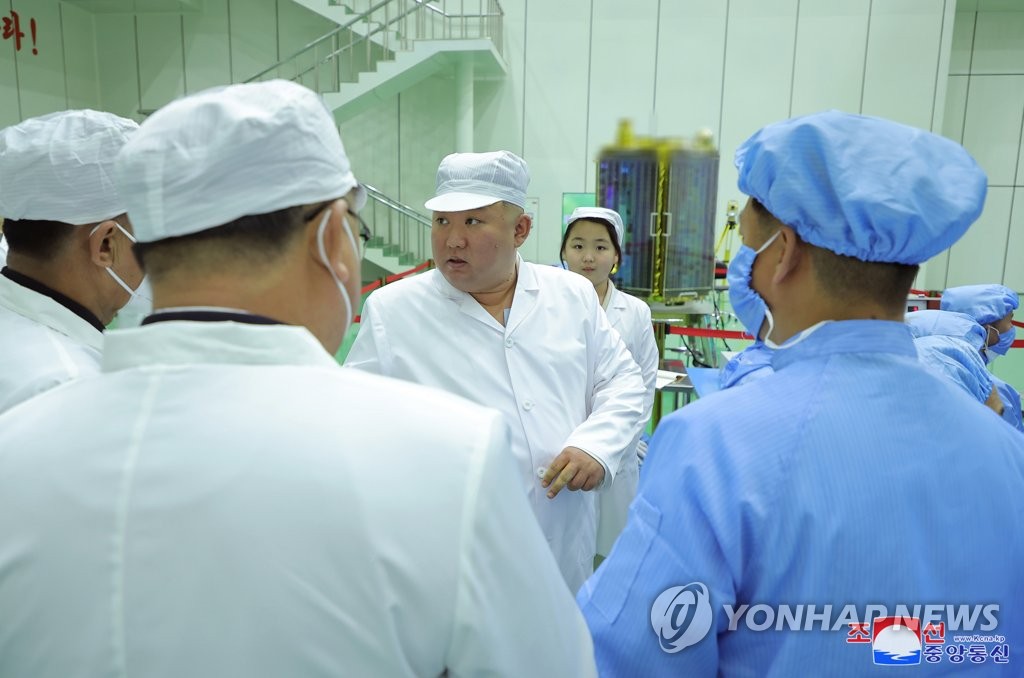N. Korean leader inspects military spy satellite: state media