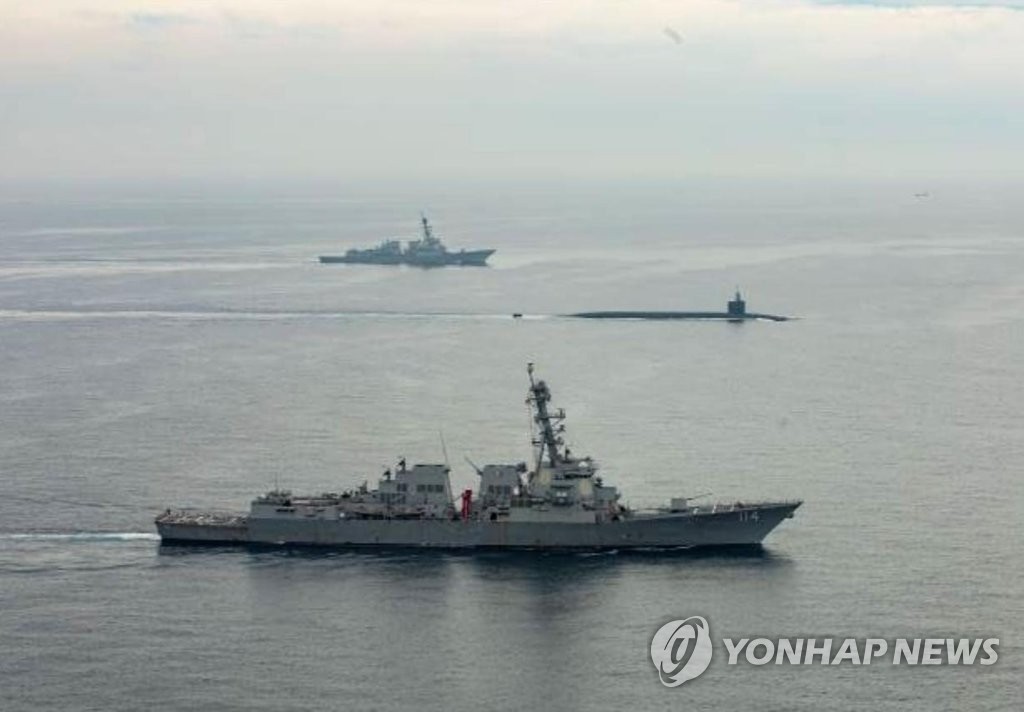 The USS Kentucky Ohio-class ballistic missile submarine (C) enters a naval base in Busan, 320 kilometers southeast of Seoul, on July 18, 2023, in this file photo captured from the U.S. Forces Korea's Facebook page. (PHOTO NOT FOR SALE) (Yonhap)