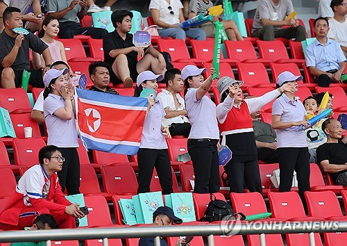 North Korean fans cheer on their men's national football team in their Group F match against Chinese Taipei in men's football at the Asian Games at Zhejiang Normal University East Stadium in Jinhua, China, on Sept. 19, 2023. (Yonhap)