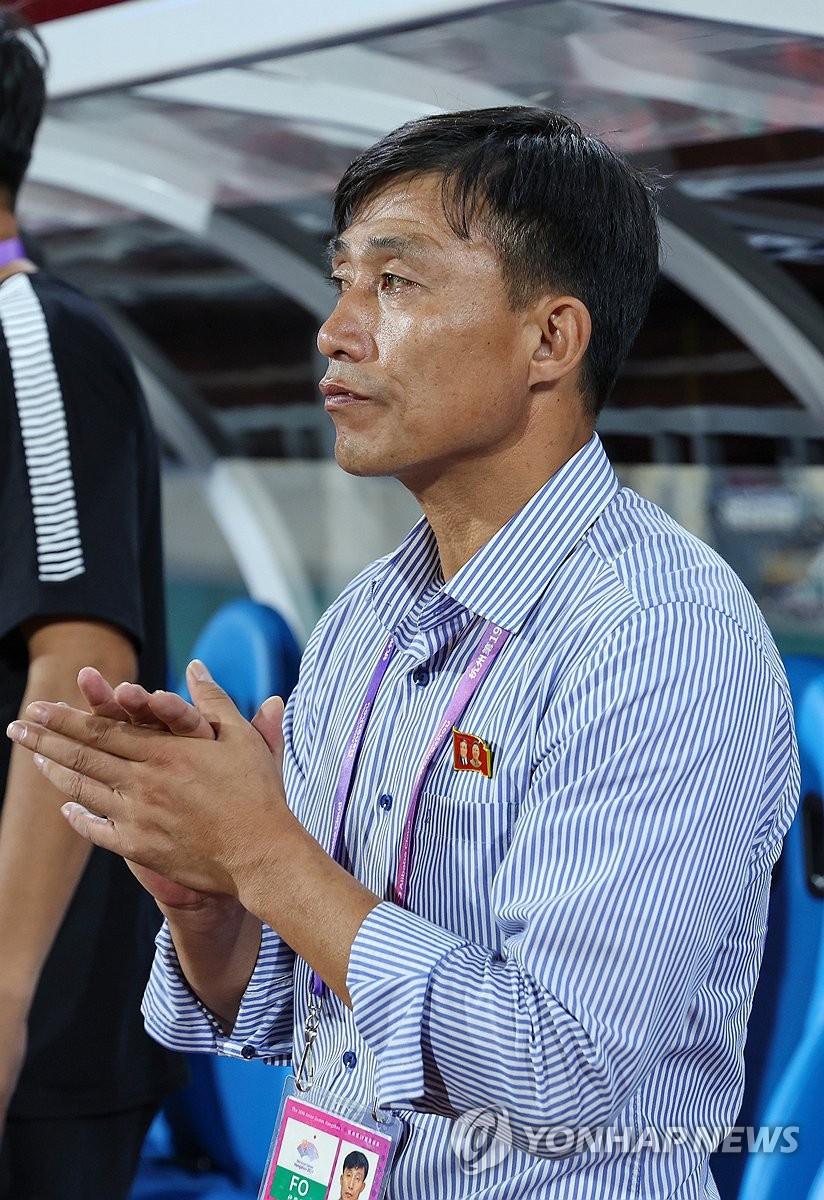 North Korea head coach Sin Yong-nam watches his team play Kyrgyzstan during the teams' Group F match of the men's football tournament at the Asian Games at Zhejiang Normal University East Stadium in Jinhua, China, on Sept. 21, 2023. (Yonhap)