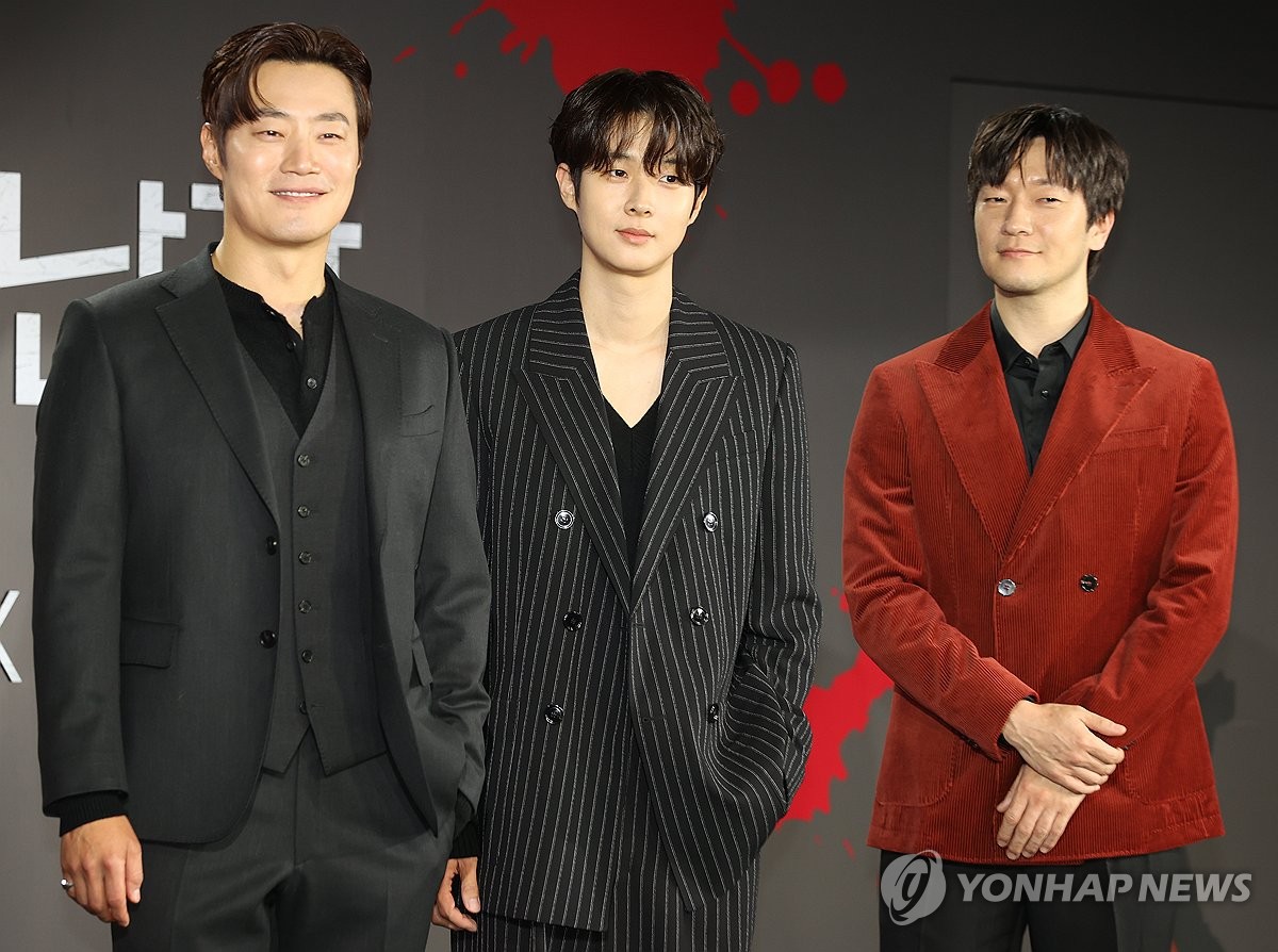 Actors Lee Hee-joon (L), Choi Woo-shik (C) and Son Suk-ku pose for photos at a press event for Netflix's upcoming original series "A Killer Paradox" in Seoul on Feb. 1, 2024. (Yonhap) 