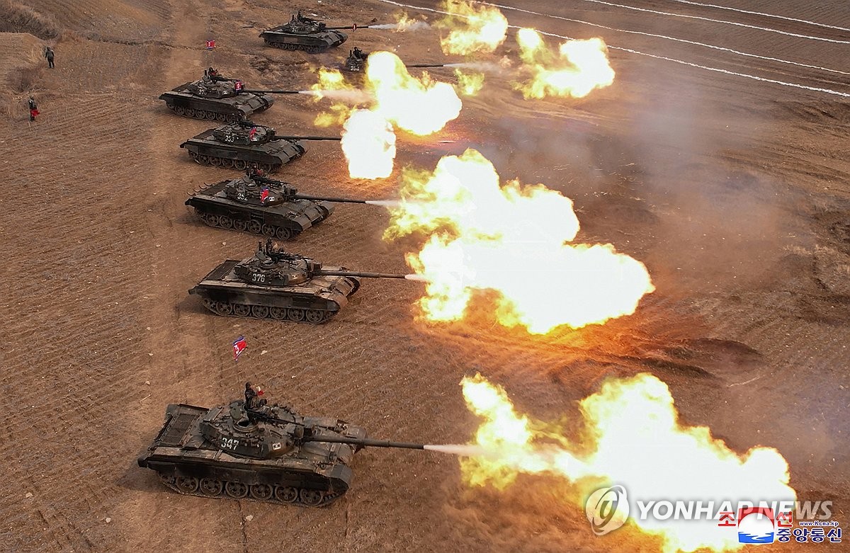 This photo, carried by North Korea's official Korean Central News Agency on March 14, 2024, shows the North holding a "training match" between tank units the previous day, guided by its leader Kim Jong-un. (For Use Only in the Republic of Korea. No Redistribution) (Yonhap)